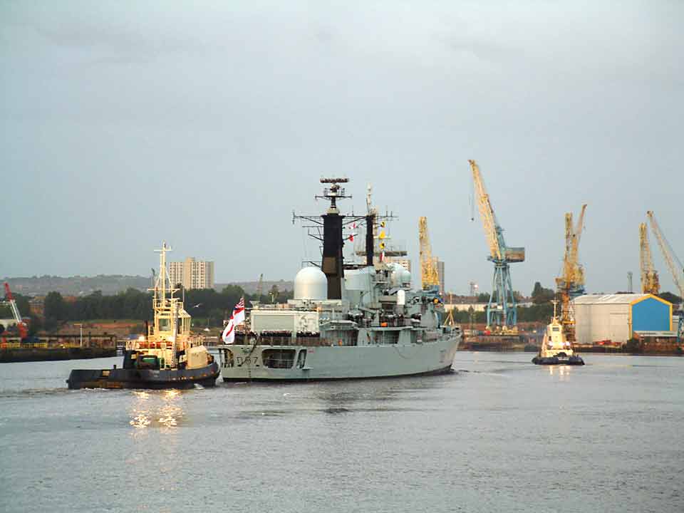 HMS Newcastle embarks on a farewell six day tour of the region. She is to be decommissioned at the end of January 2005.Now heading up the Tyne to berth at Spillers Wharf, Newcastle, 